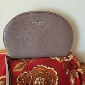Kate Spade Taupe Leather half Moon wristlet.